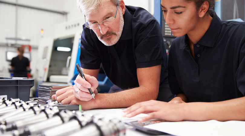 Two engineers with metallic objects