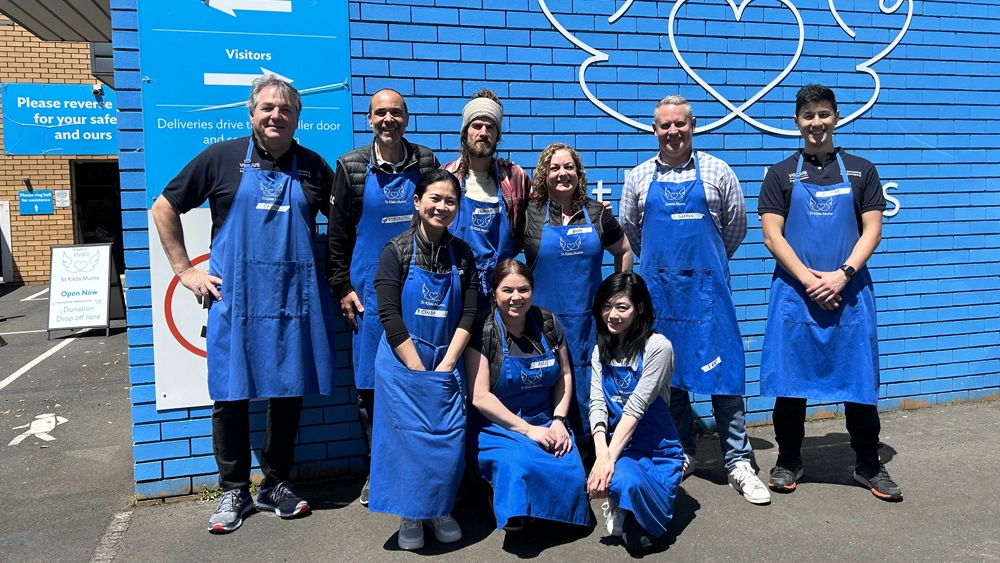 Photo of Vocus volunteers with aprons on outside ready for work