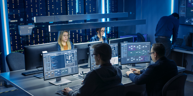 Team of IT Programers Working on Desktop Computers in Data Center System Control Room. Team of Young Professionals Working In Software and Hardware Development, Doing Coding