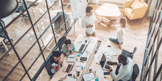 Young people work in modern office.