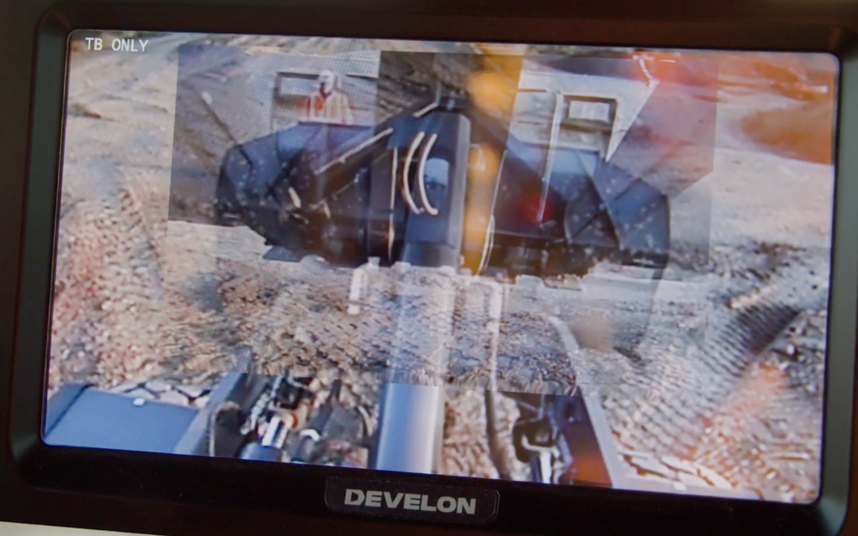 Operators can see through the DEVELON wheel loader bucket after activating the Transparent Bucket feature.