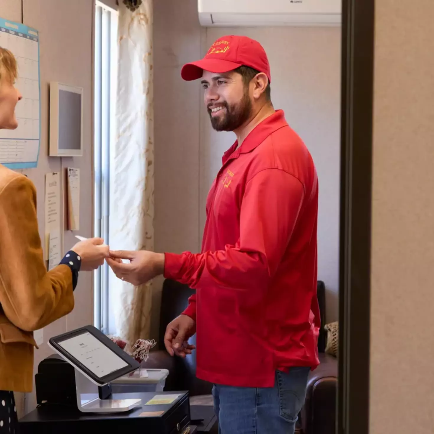 business owner taking payment