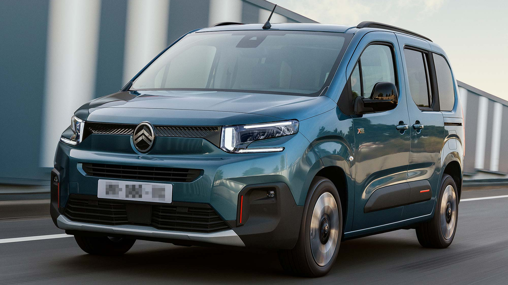 Citroën Berlingo driving on a road. A Motability Scheme accessible car