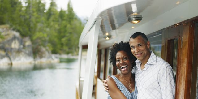 Mature couple embracing on yacht, portrait