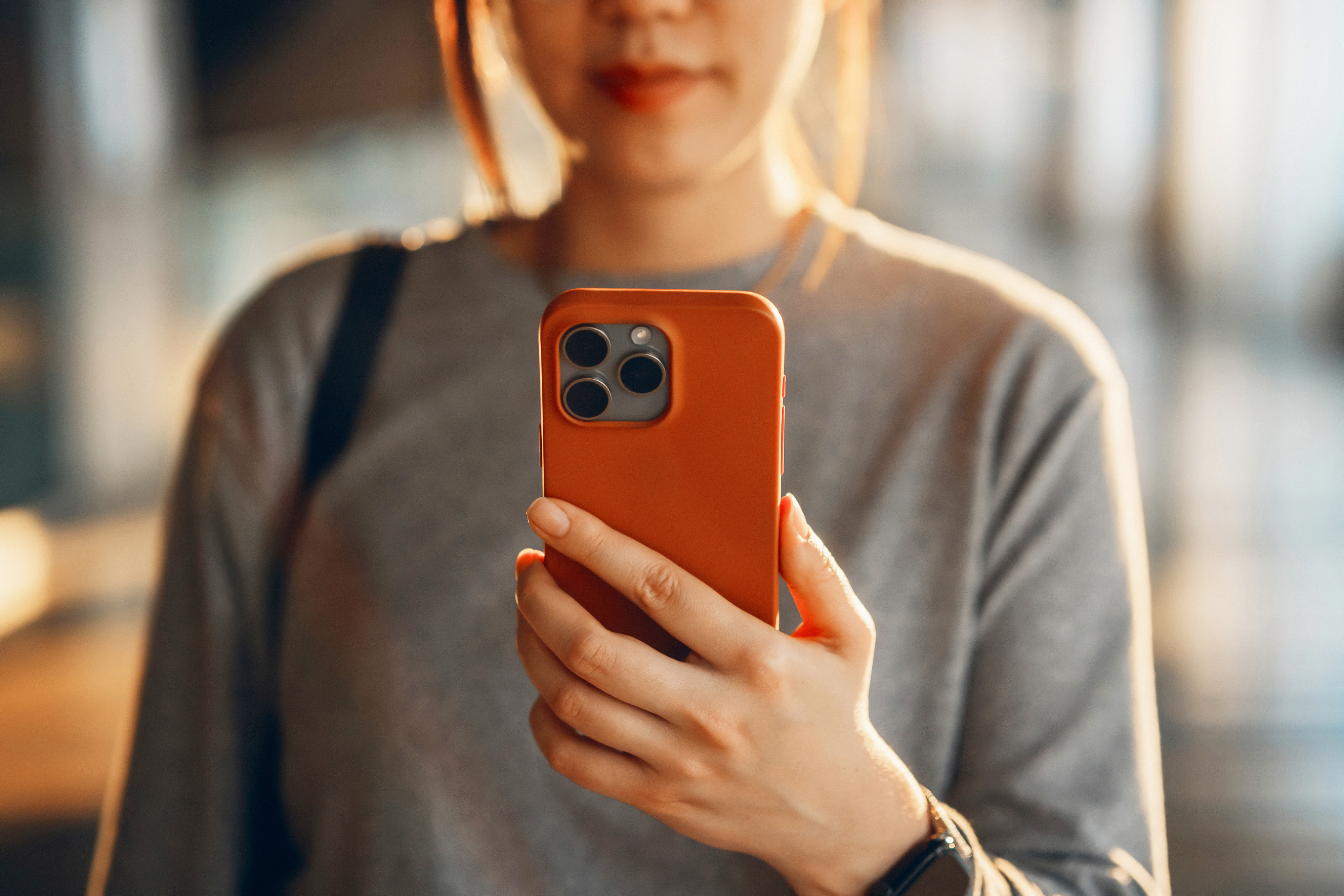customer looking at mobile phone