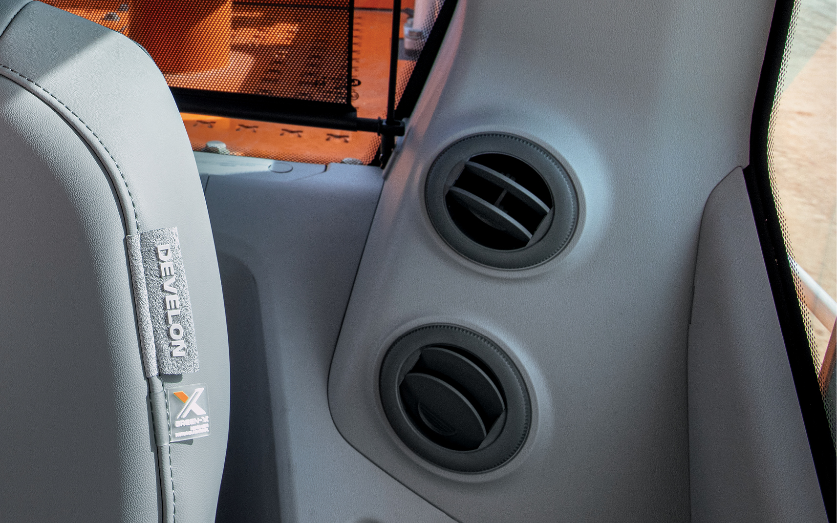 The heating and air conditioning system in a DEVELON heavy equipment cab.