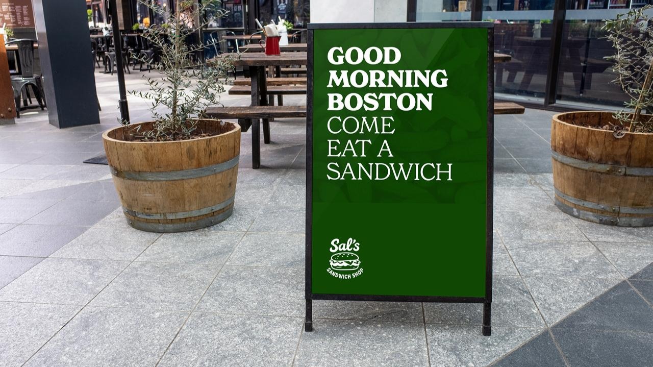 A sign on a sidewalkAI-generated content may be incorrect.