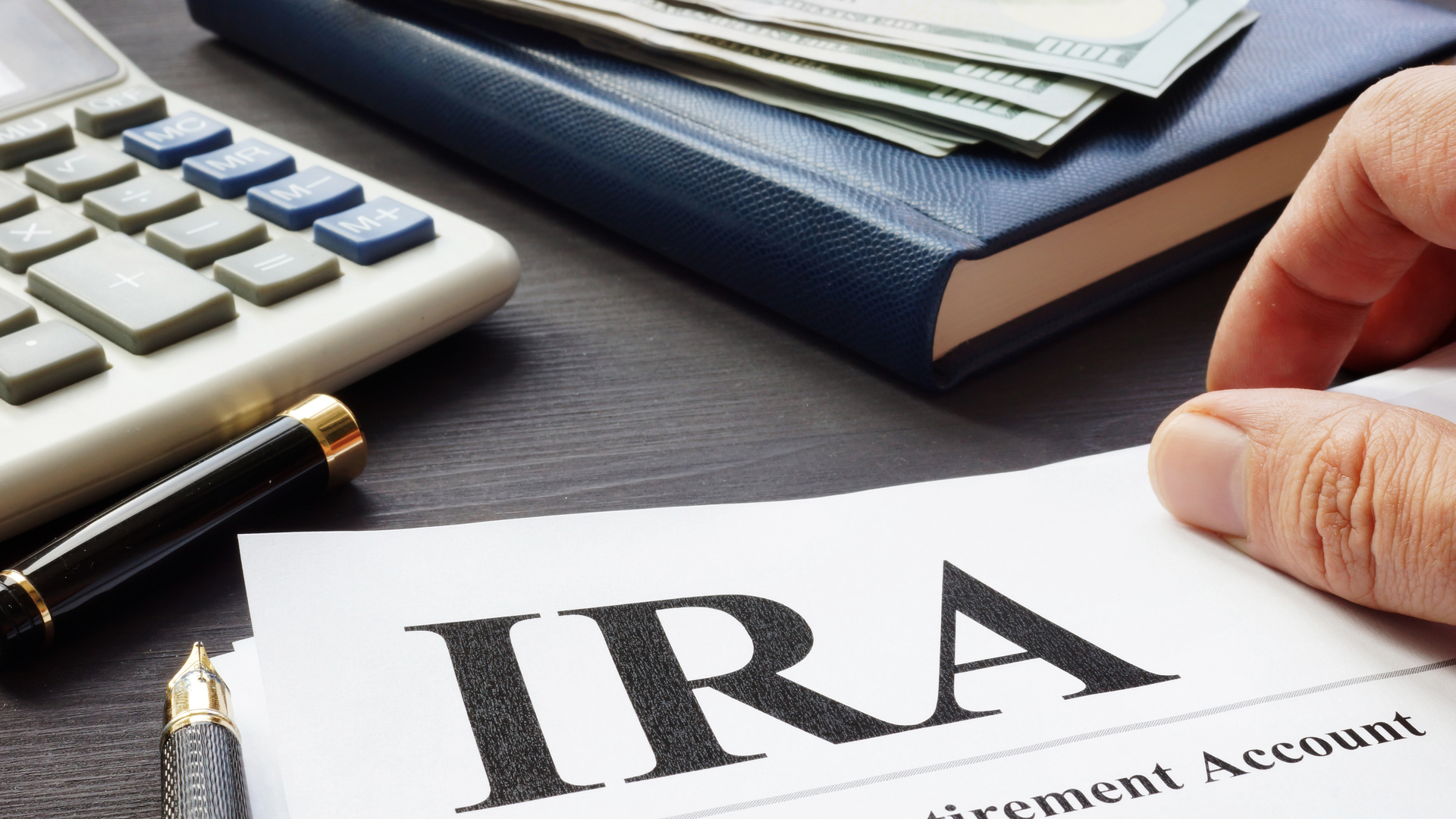 Documents about Individual retirement account IRA on a desk.