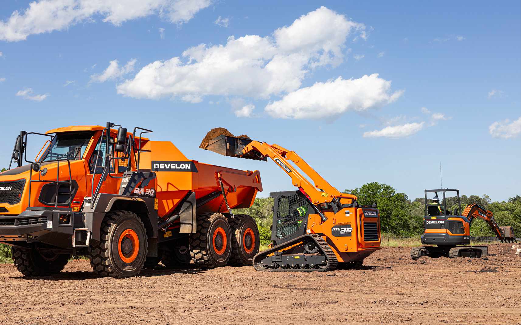 A DEVELON DTL35 compact track loader lifts dirt into a DEVELON articulated dump truck.