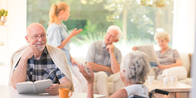 Man talking with disabled woman