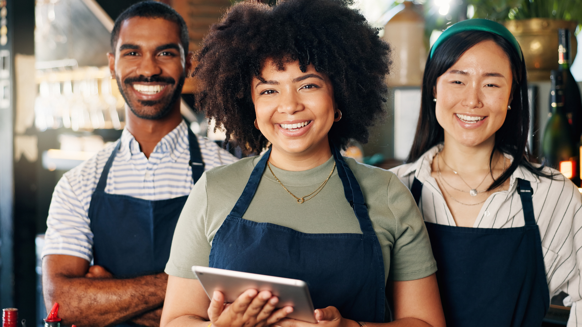 Diversity, restaurant and portrait of team at bar with manager, waiter and waitress at startup with digital app. Bistro, service barman and welcome, happy small business owner at cafe with tablet.