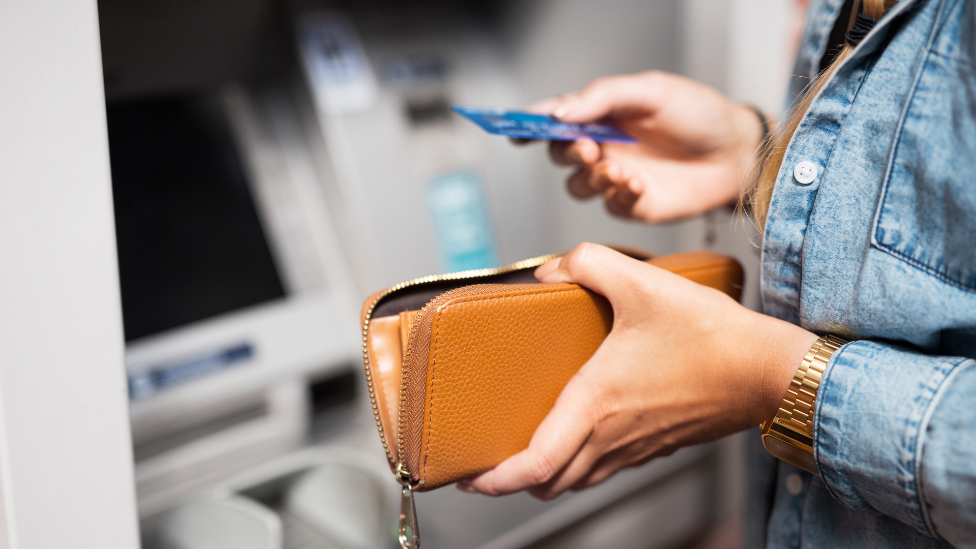 Woman withdrawing money from ATM