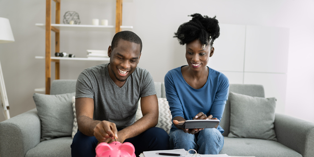 Happy Couple Doing Retire Finances Plan