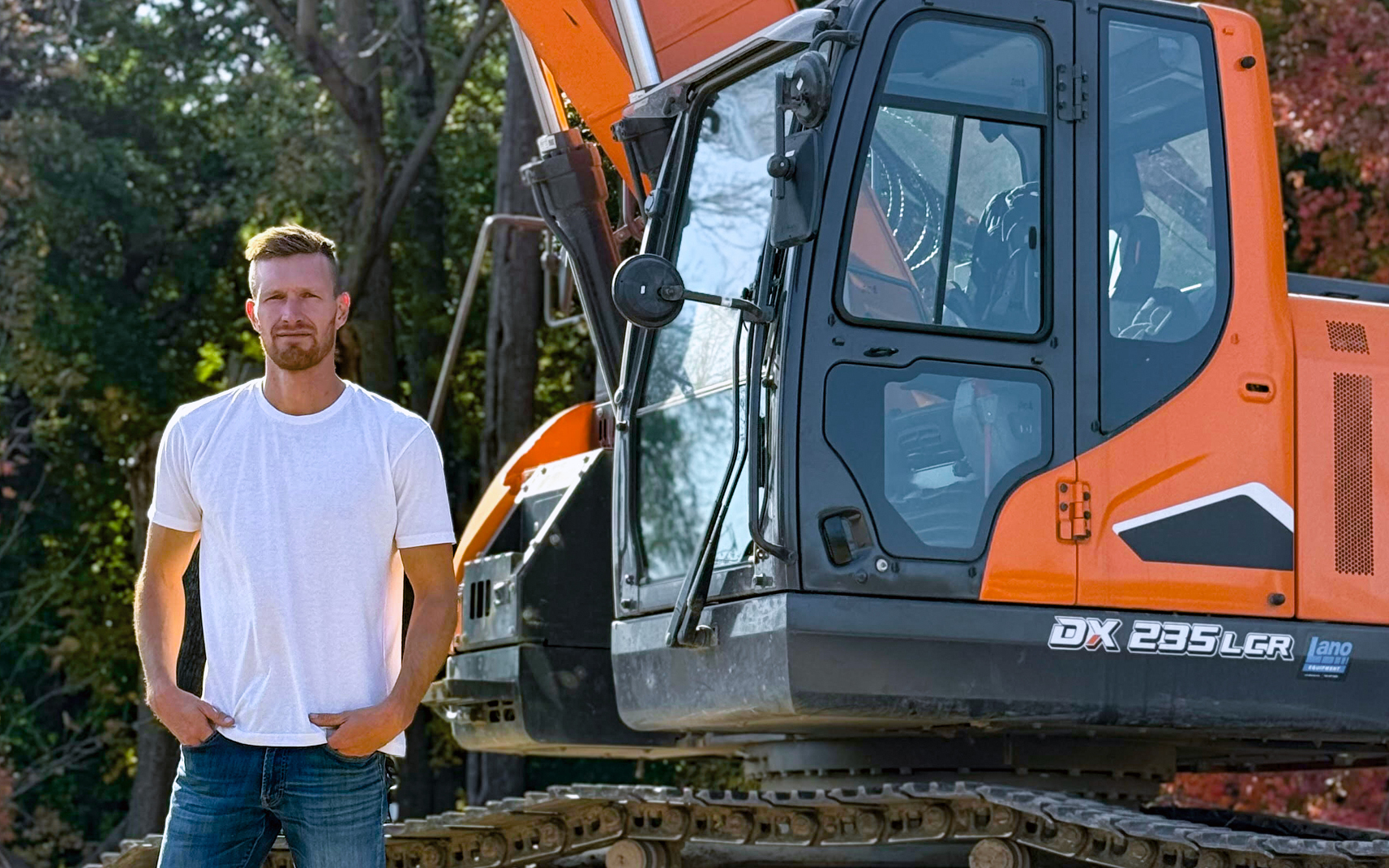 Contractor Matt Quinnell of Advanced Wall Structures in Minnesota and his DEVELON DX235LCR-7 excavator.