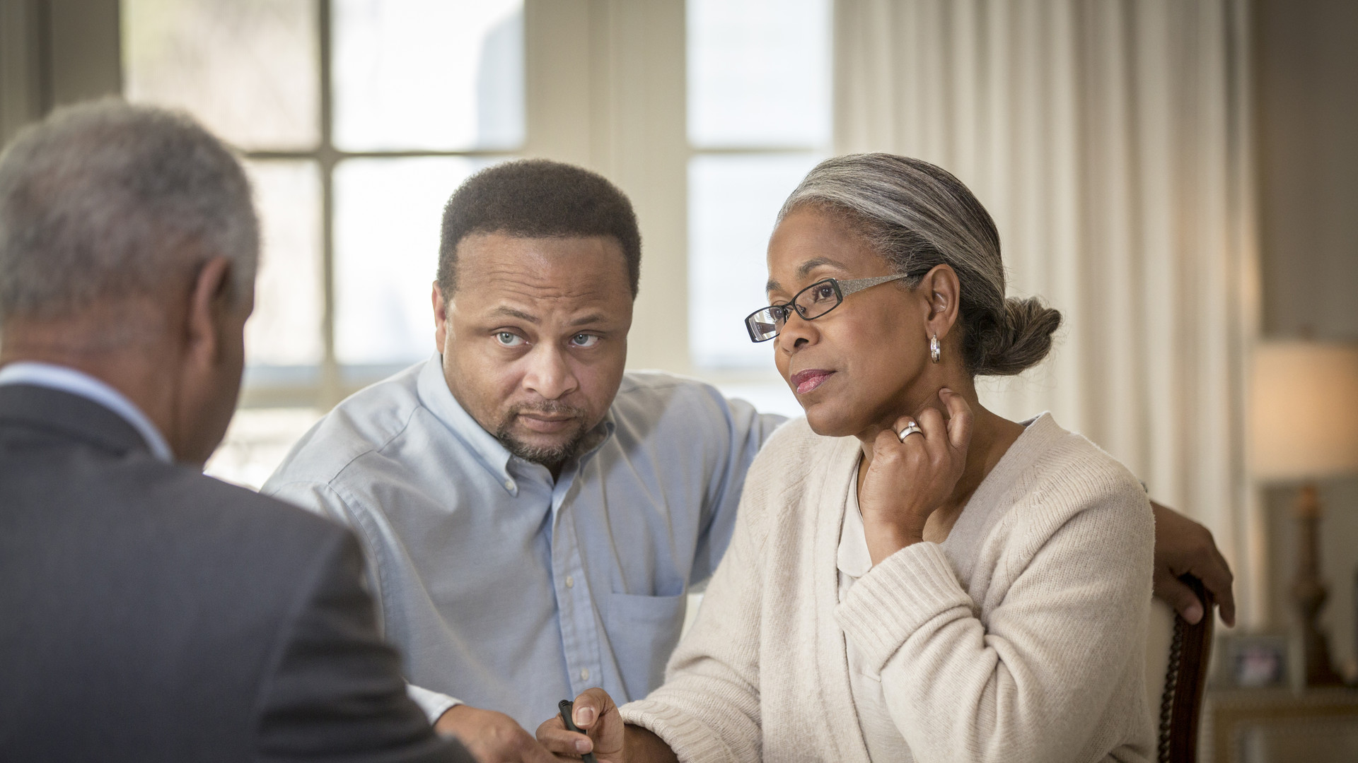 African American couple talking to businessman
