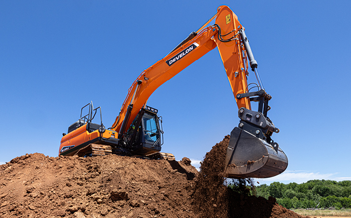 A DEVELON -7 Series crawler excavator working on a job site.