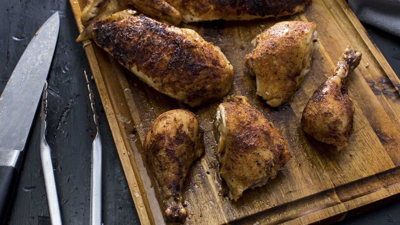 grilled chicken on cutting board