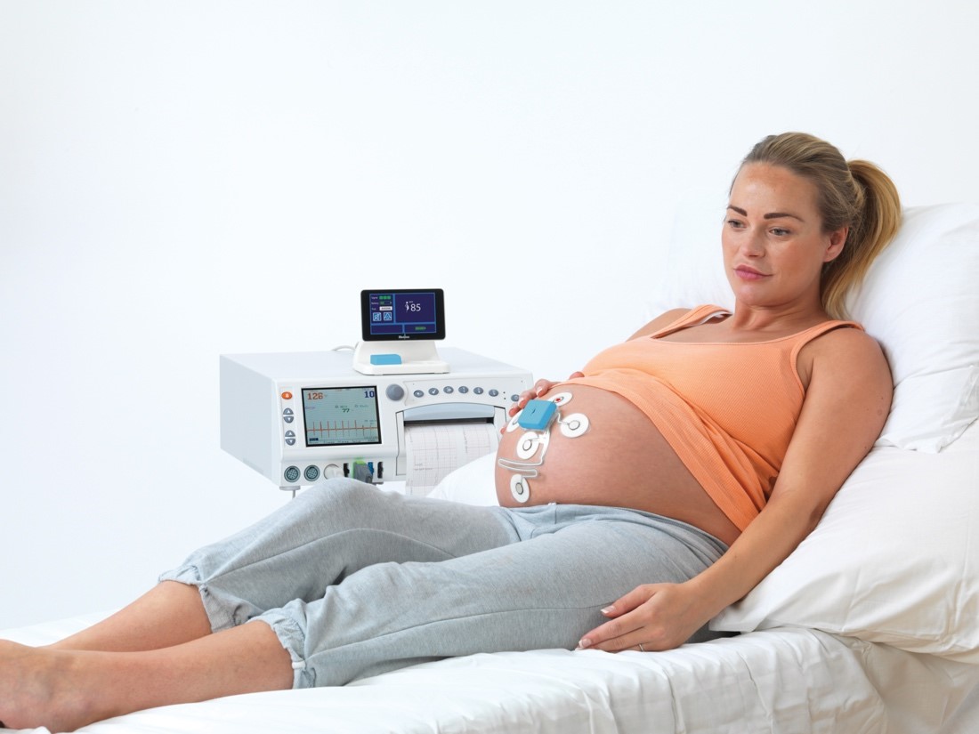 Expectant mother with Novii wireless monitor