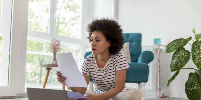 Woman paying bills online