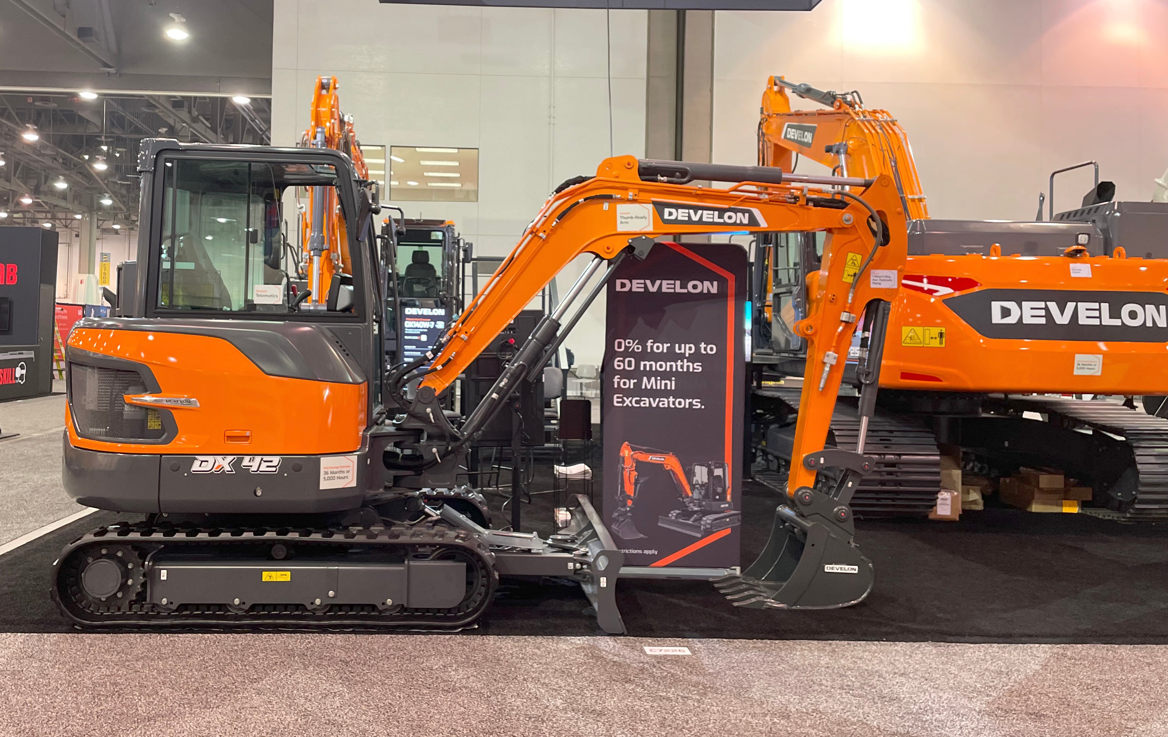 DX42-7 mini excavator and DX225LC-7X crawler excavator on display at World of Concrete 2024.