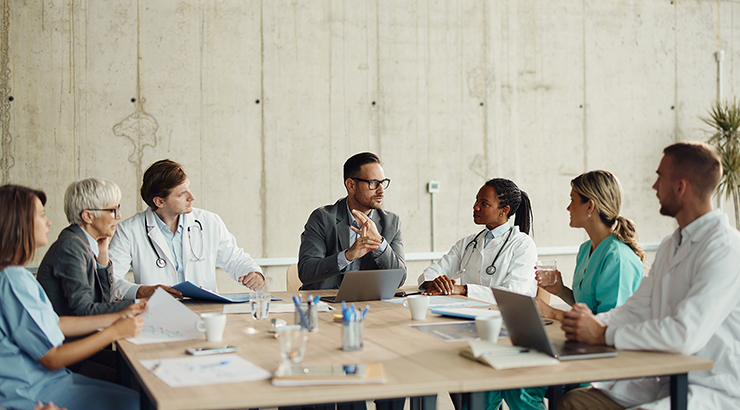 Healthcare leaders collaborating on an integration strategy to align people, processes, and technology across the system.