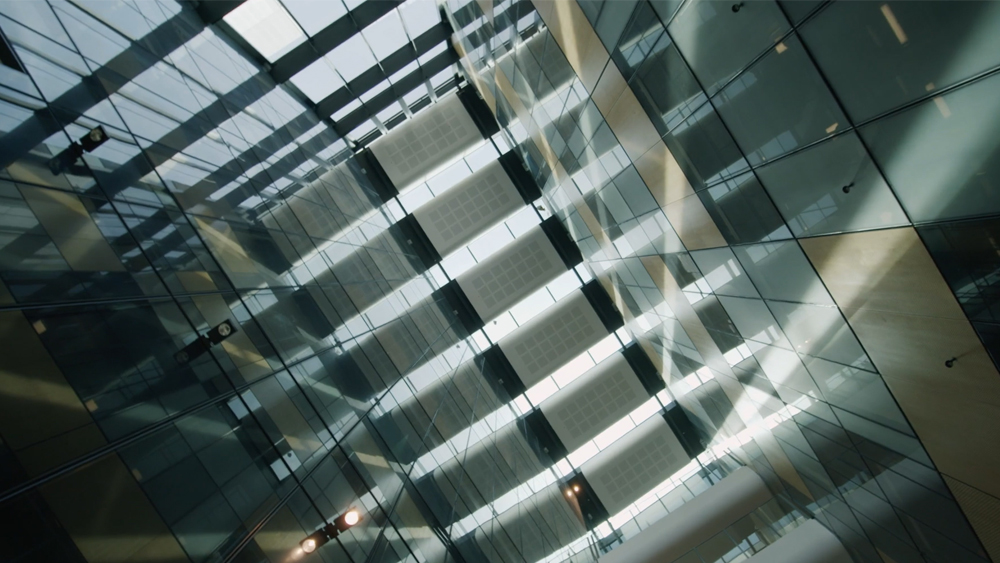 Stylistic image from a still of the BankVic Vocus Case Study video showing the interior of BankVic office building looking up