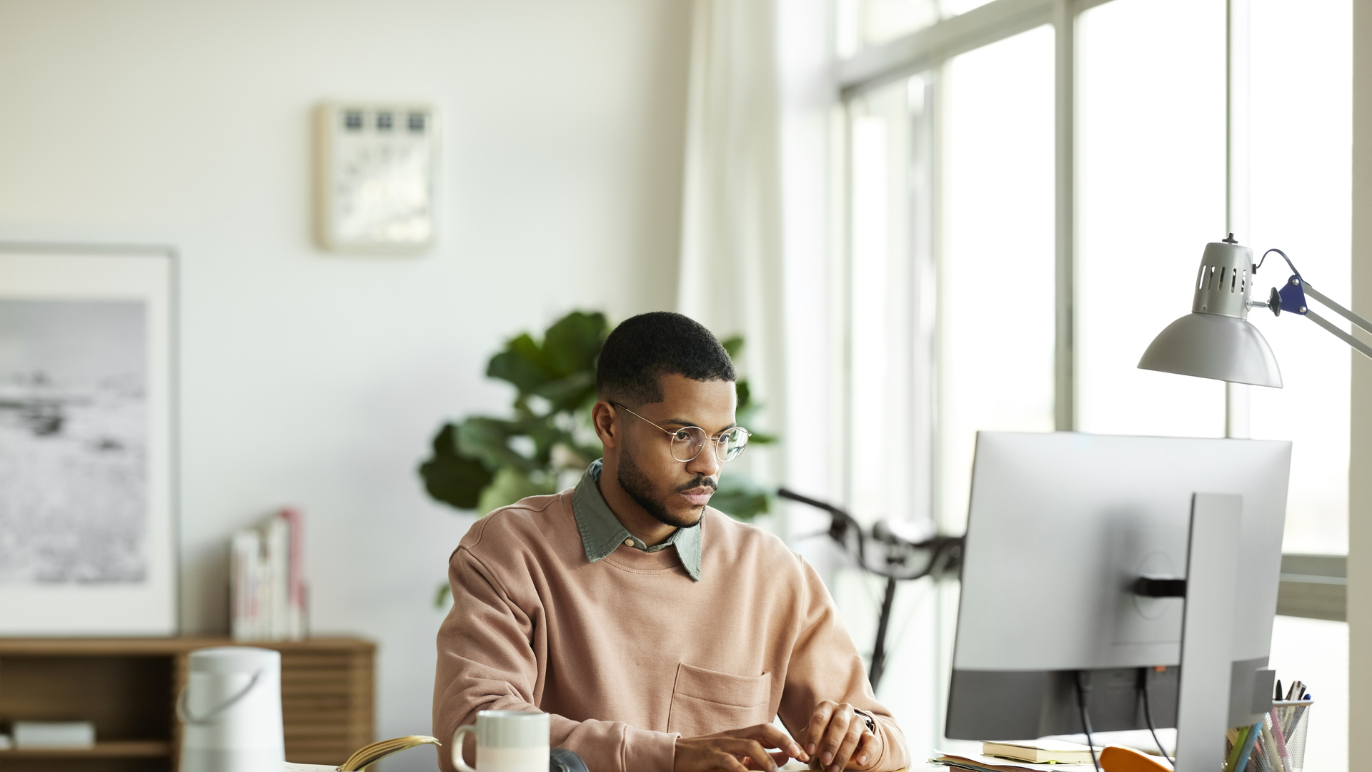 Freelancer Using Computer At Home Office