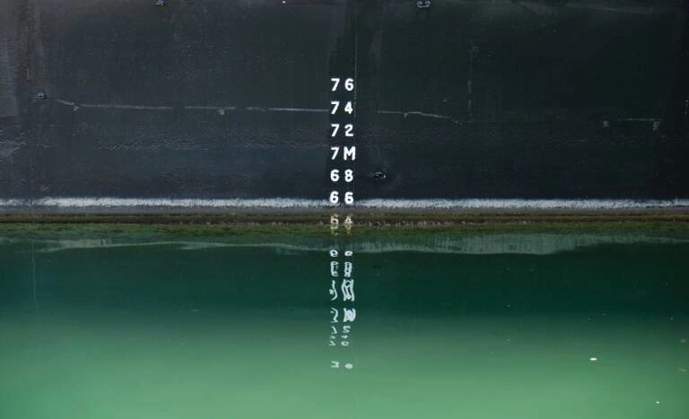 Image of numbers entering a body of water