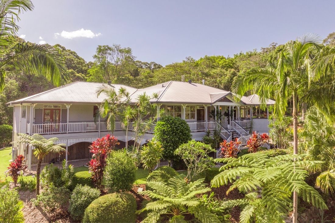 Queenslander-style house set in lush extensive garden