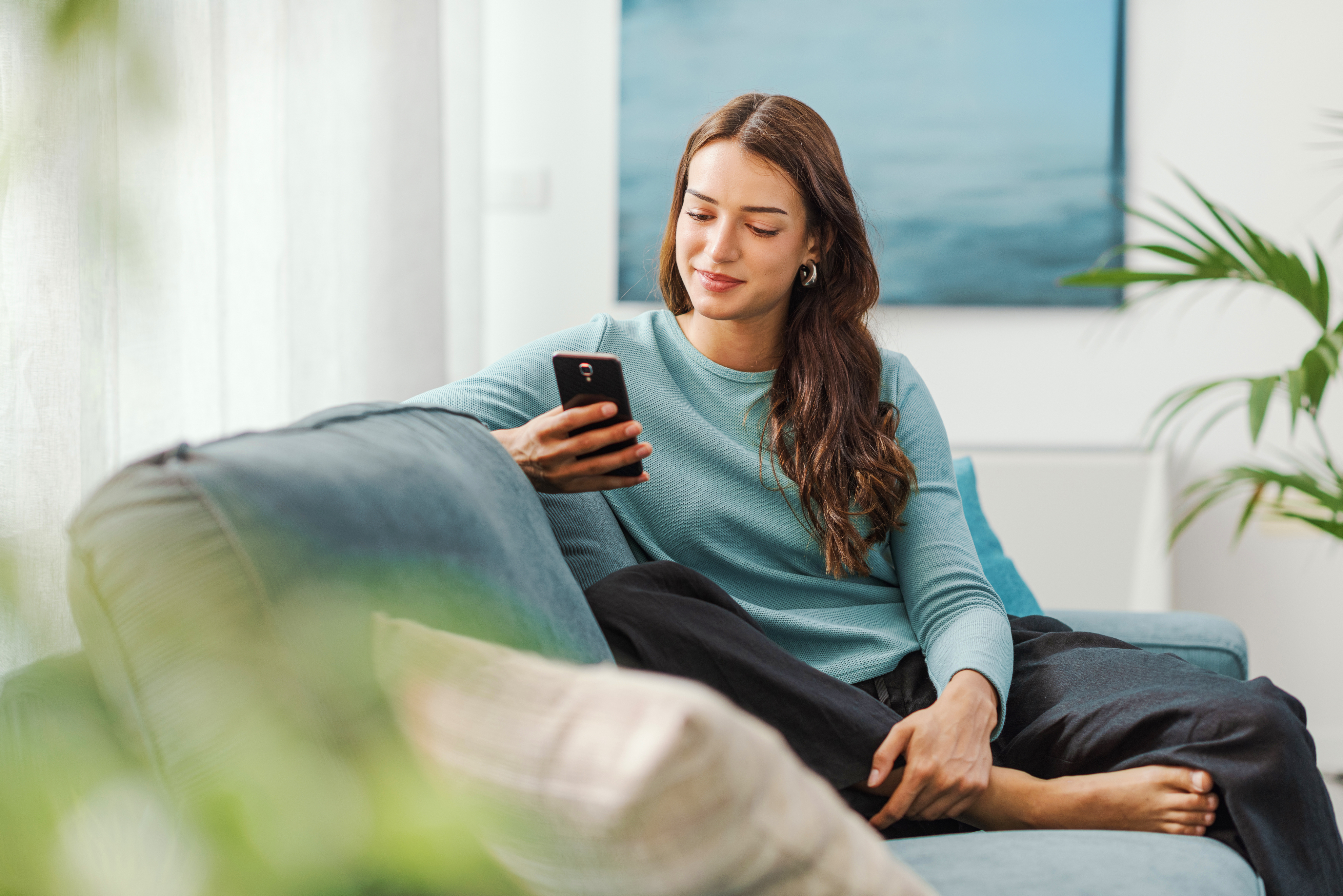 woman looking at mobile phone