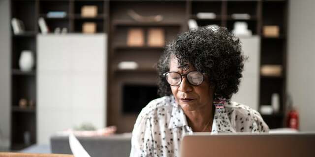 Senior woman working at desk.jpeg