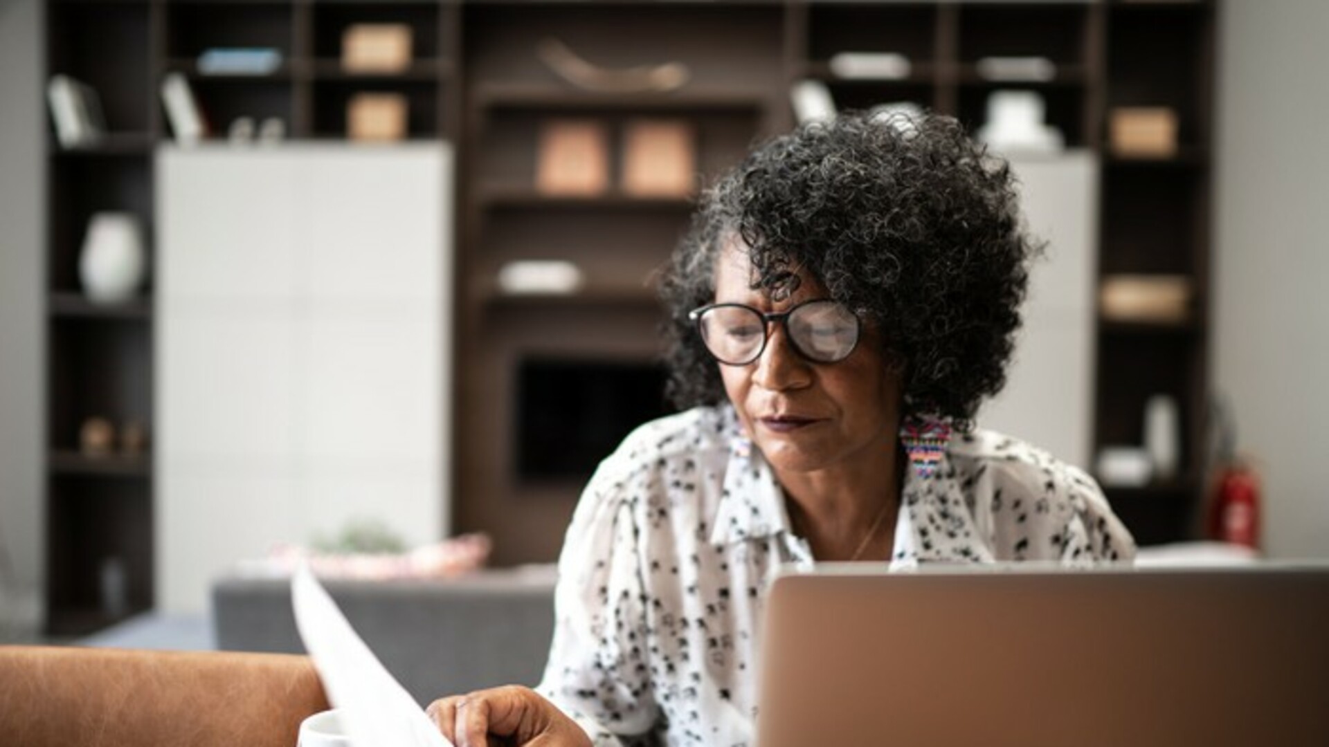 Senior woman looking at paper.jpg