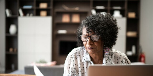 Senior woman looking at paper.jpg