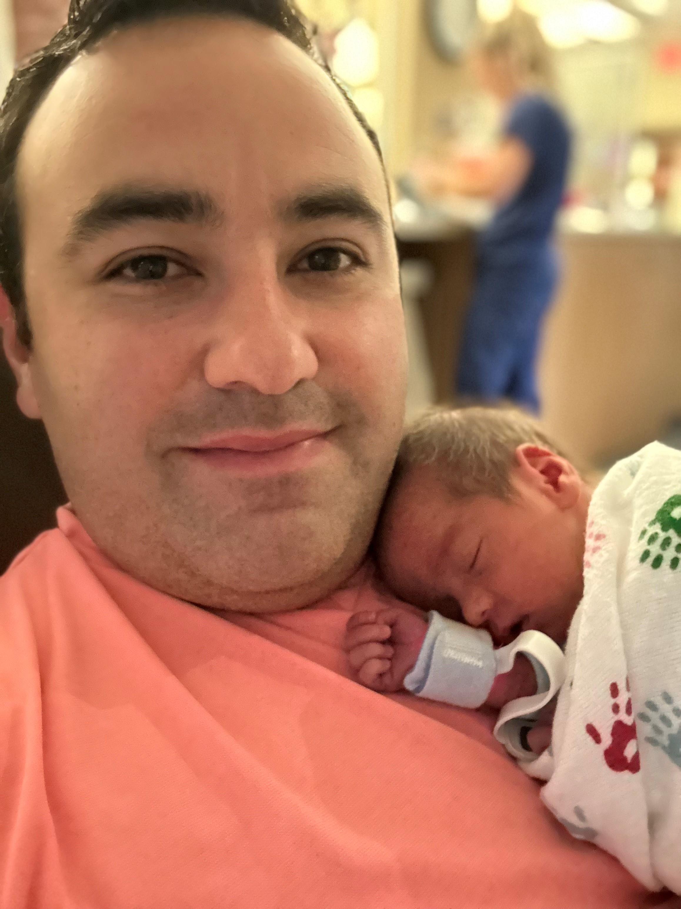 Eduardo with newborn.jpg
