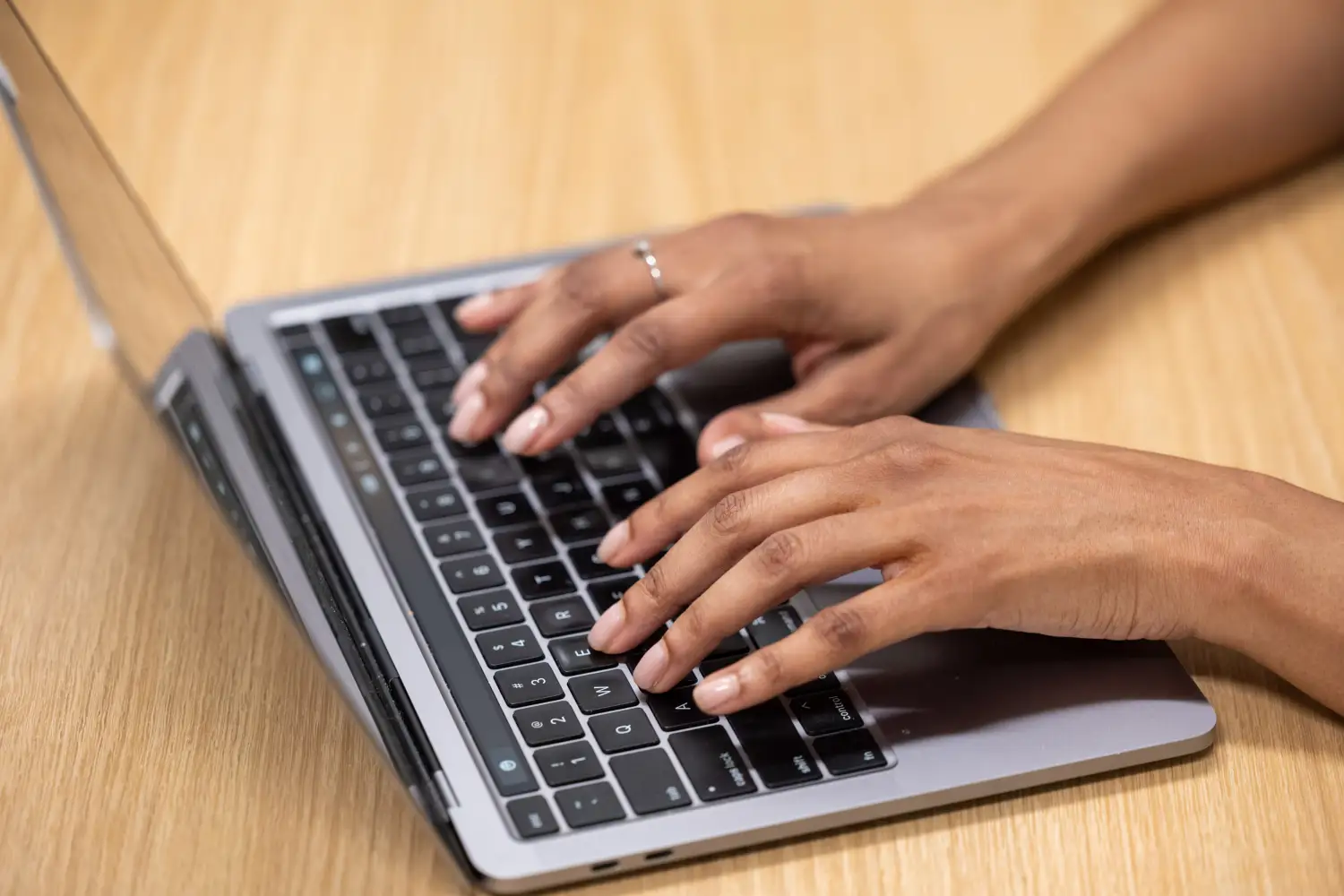 Close-up of consultant's hands navigating a professional services automation software