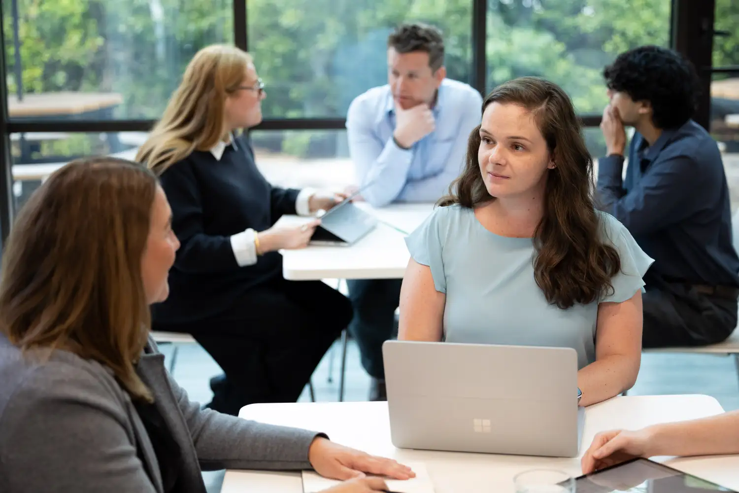 Project manager addressing a client's questions about optimizing business processes with Salesforce-native PSA