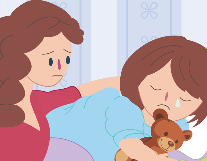 Mother comforting sad child in bed