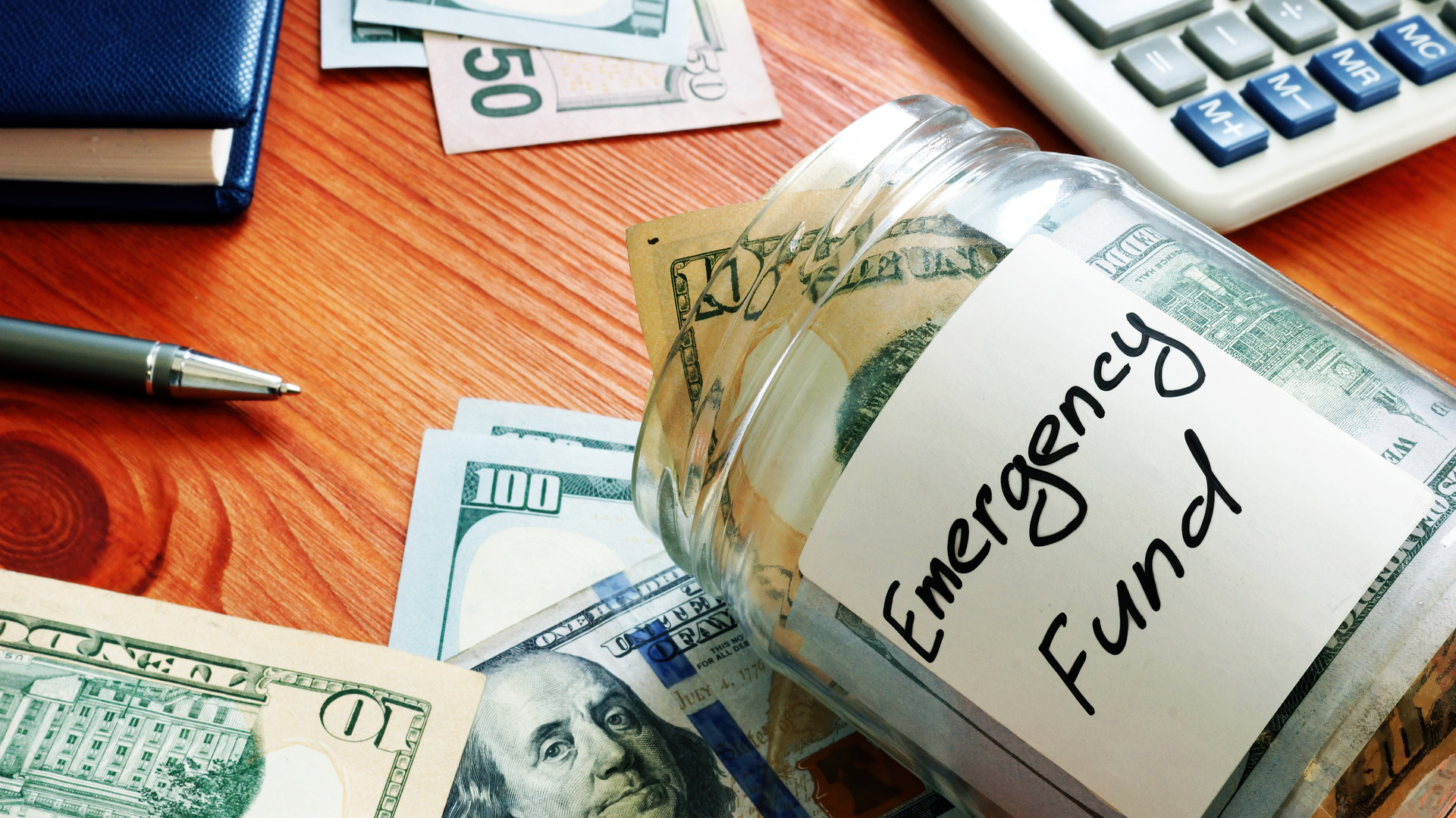 Emergency fund in the glass jar with cash.