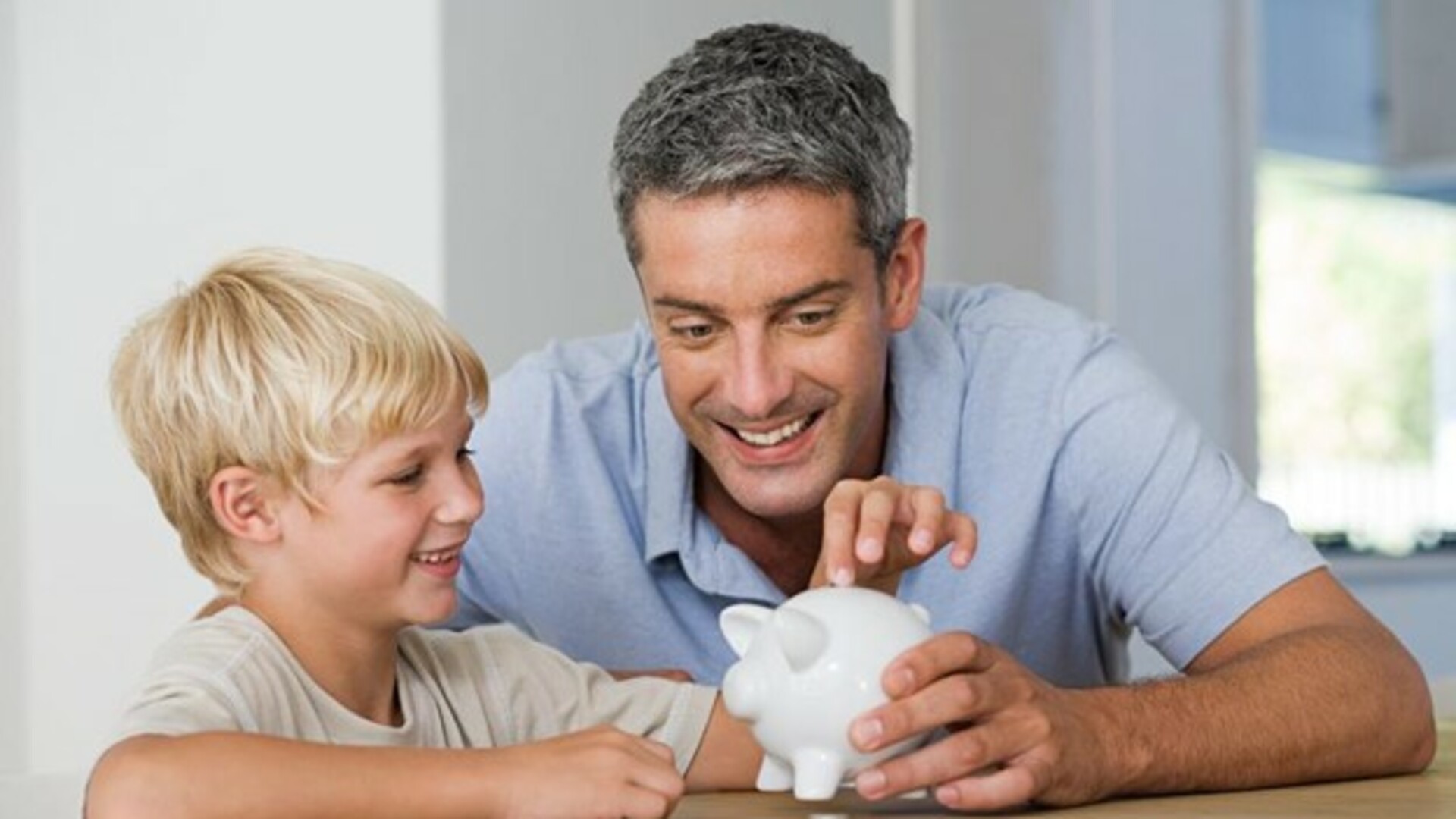 kid with piggy bank.jpg