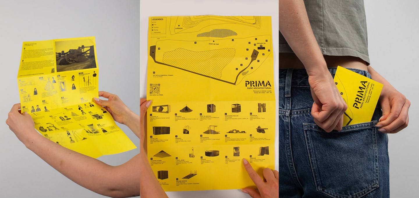 Two hands hold a yellow foldable map of the PRIMA park, designed by students to facilitate visitor navigation and interpretation.