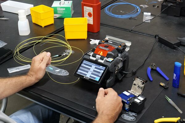 Precision fiber optic fusion splicer machine setup for BICSI cable termination training