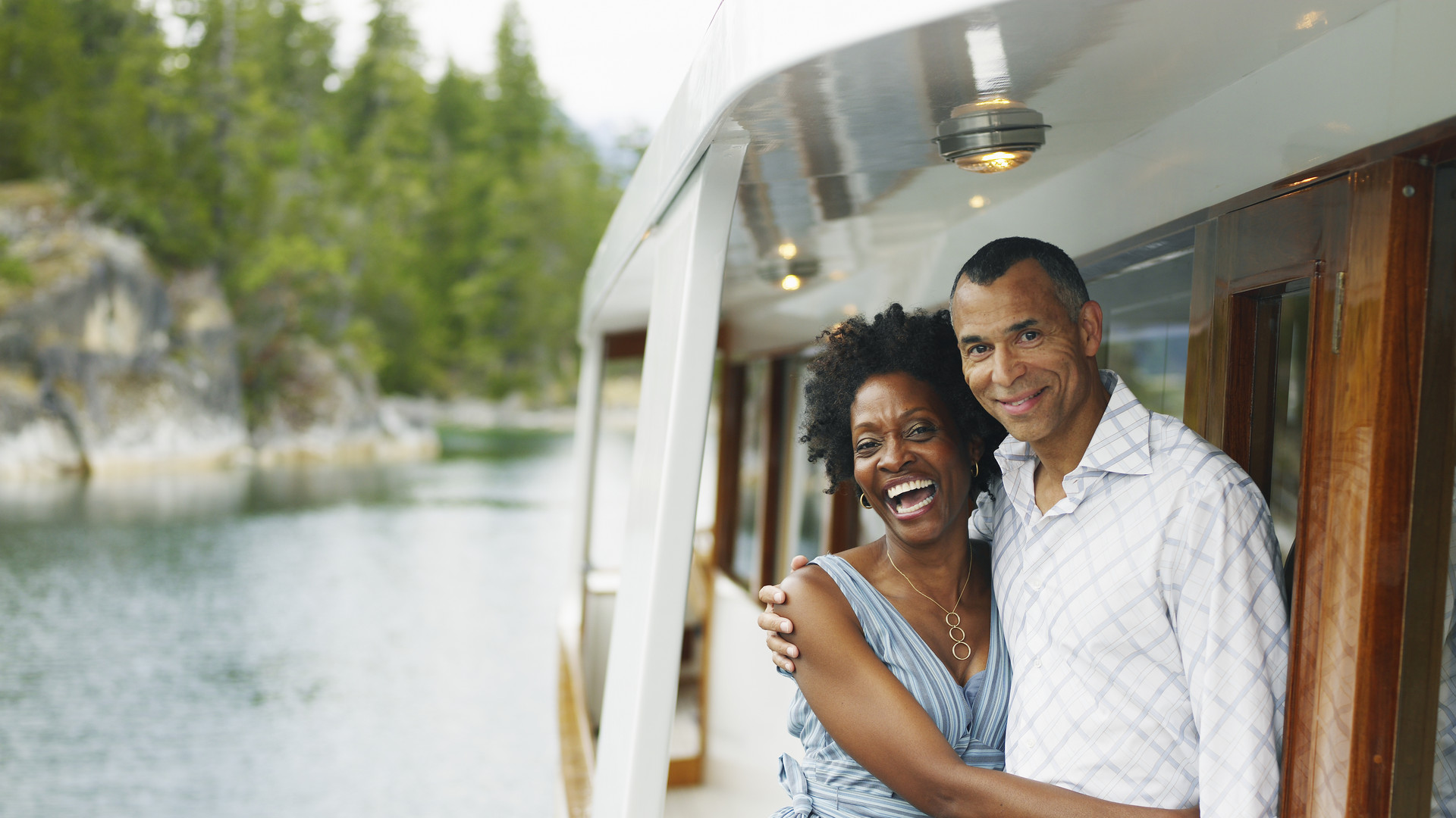 Mature couple embracing on yacht, portrait