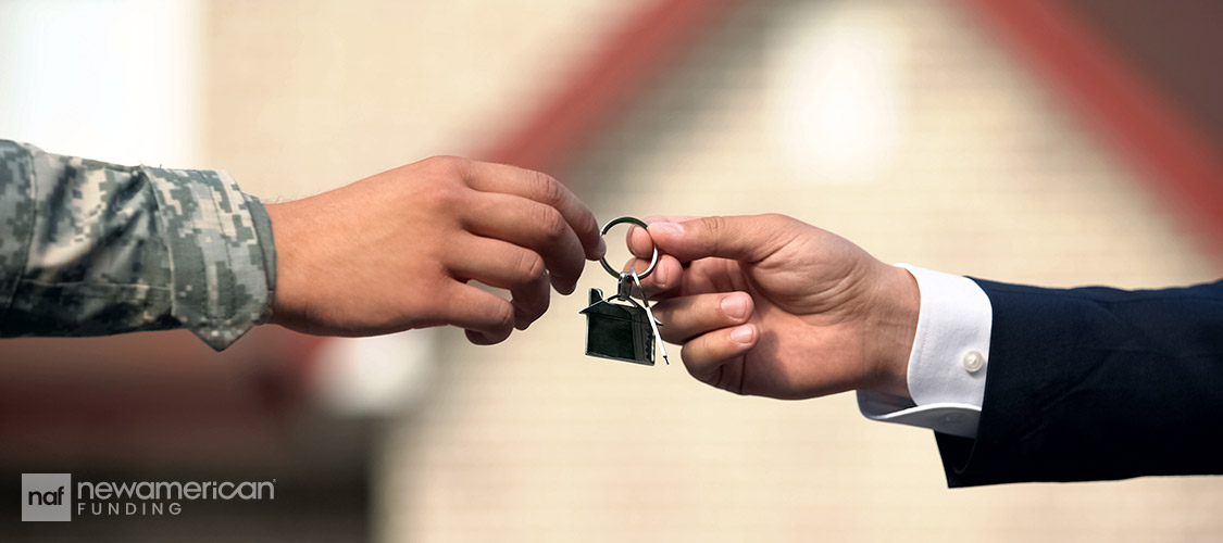 handling over house keys to veteran