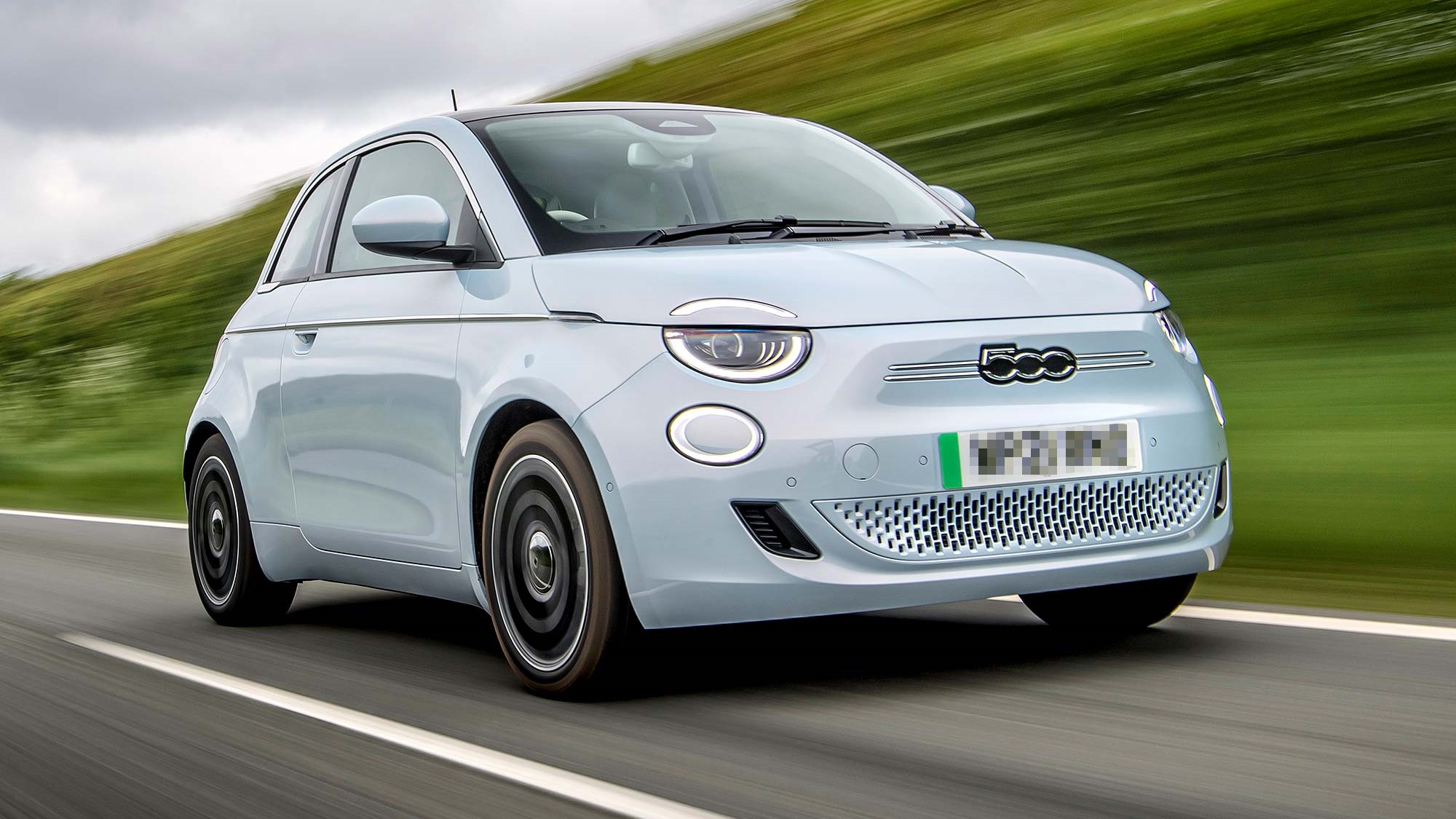 Silver Fiat 500e driving on the road