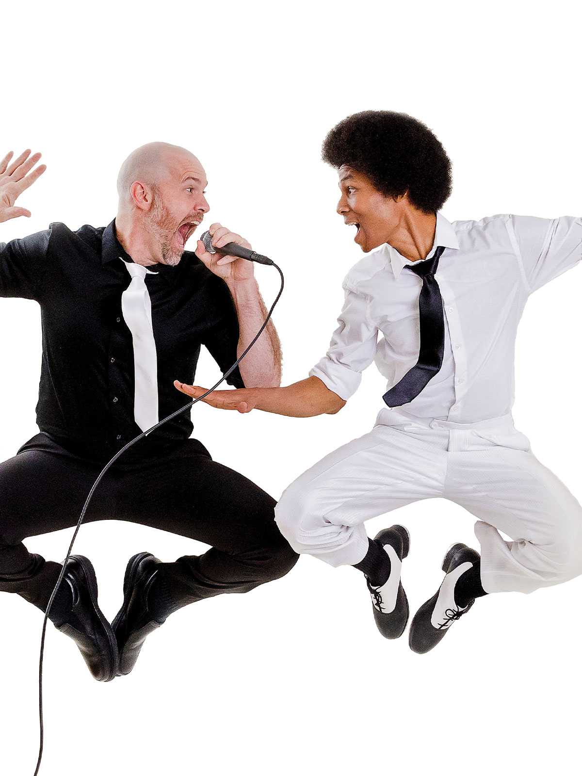 Collision of Rhythm duo jumping in the air during a high-energy musical performance.
