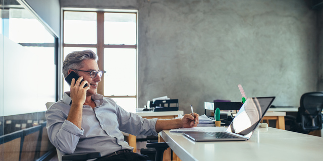 Businessman in office talking on phone