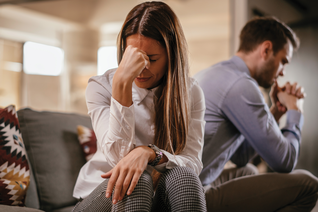 Woman and man looking distressed