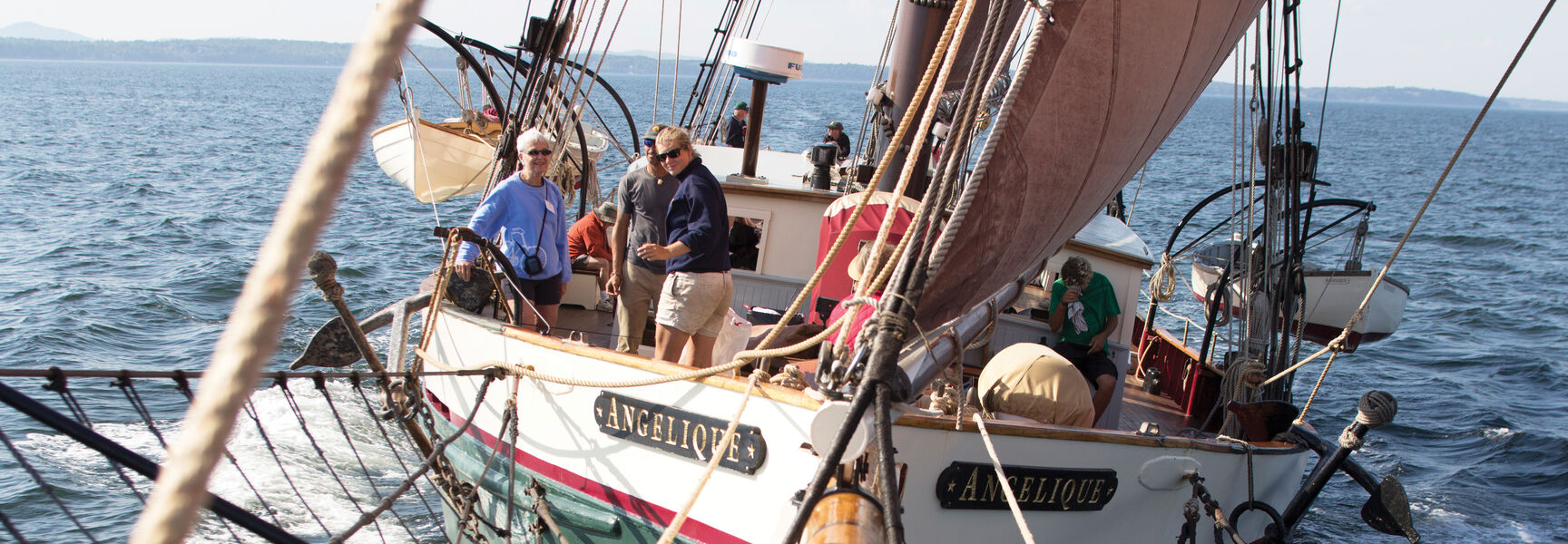 Passengers sail on the 95-foot windjammer Angelique along the Maine coast.