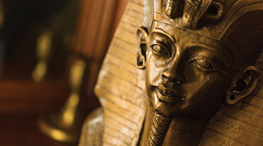 A detailed close-up of King Tut's golden funerary mask for an online lecture about uncovering new secrets through technology.