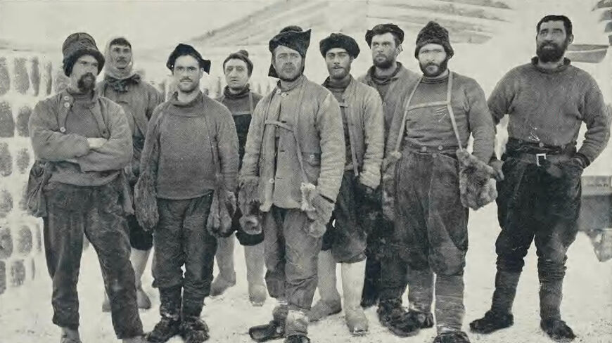 A group portrait of Captain Scott and his team wearing heavy cold-weather gear during their expedition to the South Pole.
